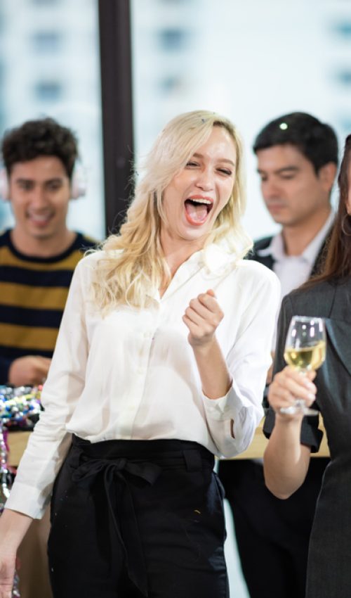 Young,Business,People,Have,Fun,At,A,New,Year's,Party