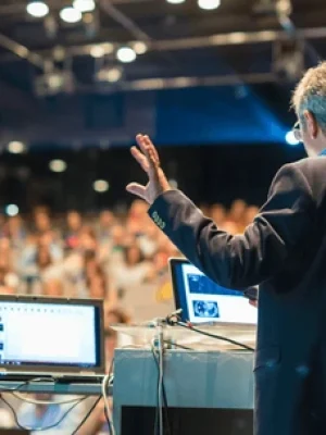 speaker-giving-talk-on-corporate-600nw-481869205